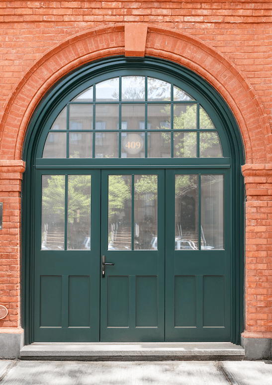 Landmark's deep green coloured wooden entry door